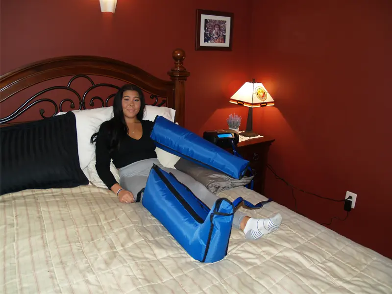 Patient receiving lymphedema compression therapy treatment at Advanced Rehab Technologies